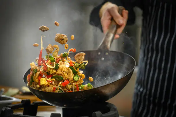 Chef Adebayo preparing traditional West African dishes